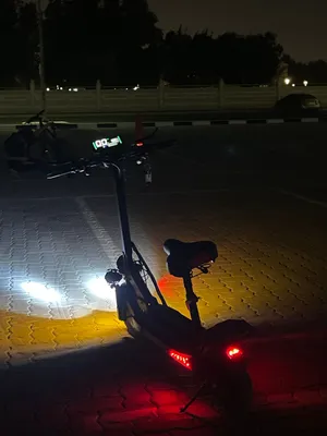 E scooter with seats top speed 65 three mods with RGB lights, speaker, and headlight