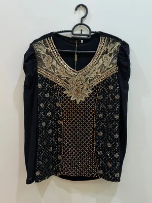 Black top with gold details for sale