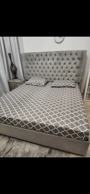 King Size Pink Upholstered Bed with Headboard and side table and mattress
