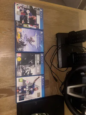 PS4 For sale with steering wheel and pedal with 4 complementary games