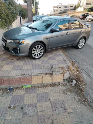 ميتسوبيشي لانسر 2015 موديل صالون أسمنتي نظيف مع مواصفات يابانية فحص كامل