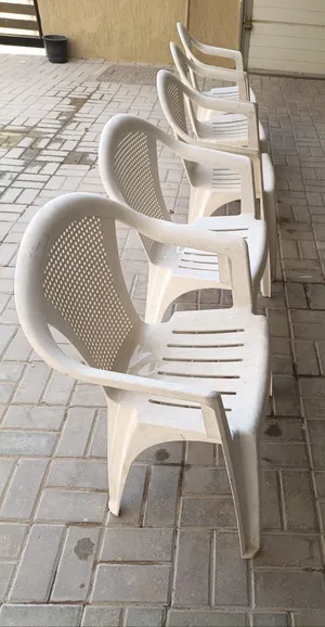 Set of 5 white Cosmoplast plastic outdoor chairs