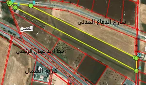 ارض 16 دونم بقوشان مستقل - المومنيه - قرب خط اربد عمان الرئيسي - 18 الدونم