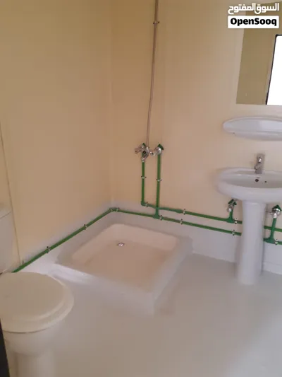 Refurbished plywood portacabin with two rooms and two toilets. 2