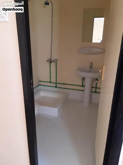 Refurbished plywood portacabin with two rooms and two toilets. 3