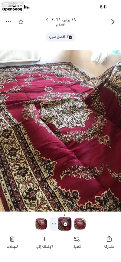 سجادة كلاسيكية بنقشة ميدالية (Medallion)، لون خمري أو نبيذي، ونقشتها من الطراز الشرقي التقليدي. 3