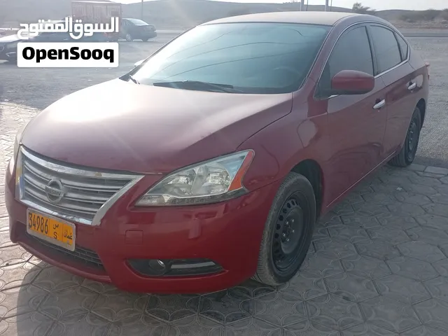 نيسان سنترا 2014 موديل أمريكي، صالون/سيدان، لون أحمر، مستعملة بحالة ممتازة