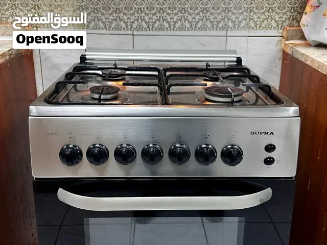 Freestanding 4 burner gas /oven with rotary electric grill 60 X 60. Brand Supra. Excellent working.