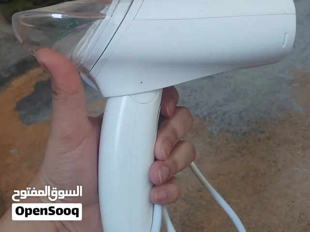 Portable, Foldable Handheld Garment Steamer designed for travel and quick touch-ups
