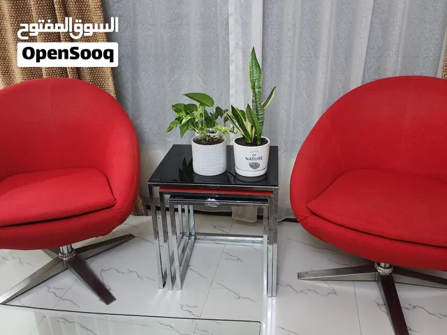 2 Red Swivel Accent Chairs – Good Condition — BD 40