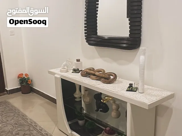 Buffe with mirror and plant decor in very good condition/بوفيه مع مرآة وديكور نباتي في حالة جيدة جدا
