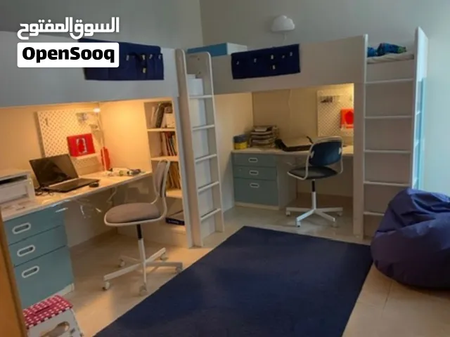 2 IKEA beds that come with 2 office chairs , one of the desks has a hole in them around 1 cm wide