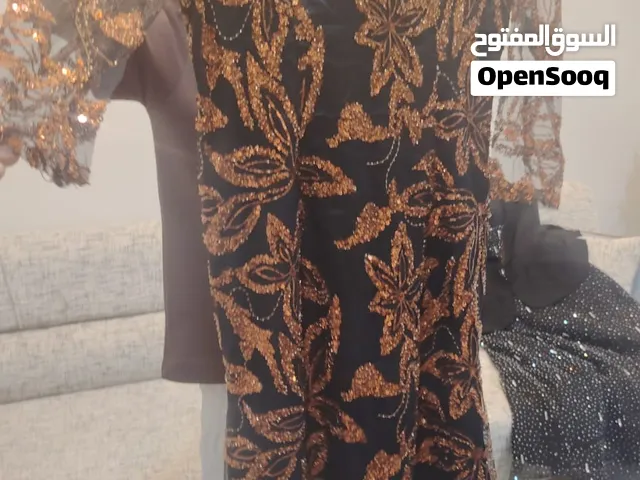 فستان سهره أسود وتول برتقالي قياس 44 السعر 60 الف
