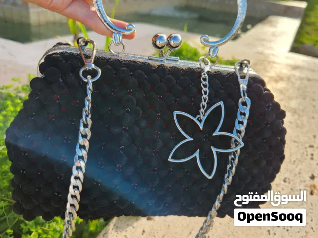 شنط يدوية للمناسبات وشنط هاتف ومديليات