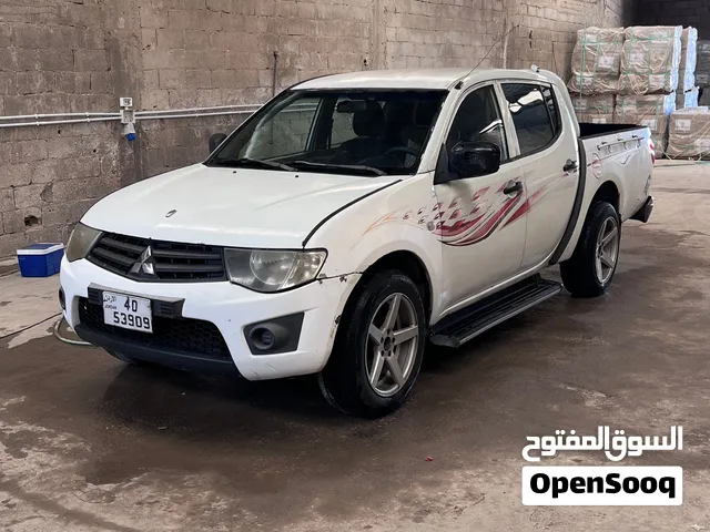 ميتسوبيشي L200 بيك اب 2012 ذات مواصفات خليجية مع جنوط ومصابيح LED فحص كامل