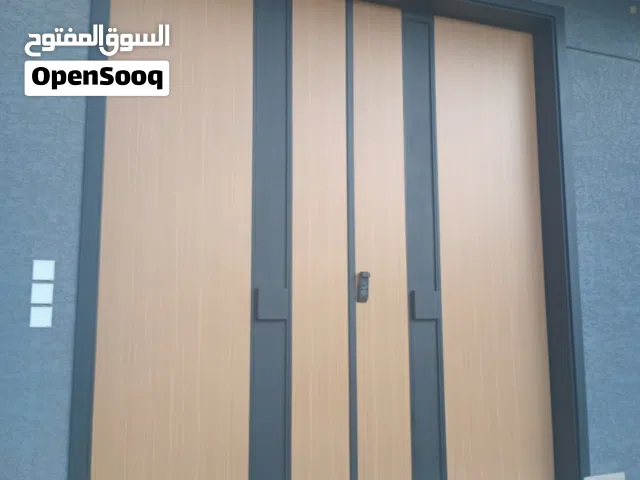 مصنع ابواب كلادينج وابواب حديد وتربزينات حديدواستيل وجميع اعمال الالمنيوم وابواب خشيب