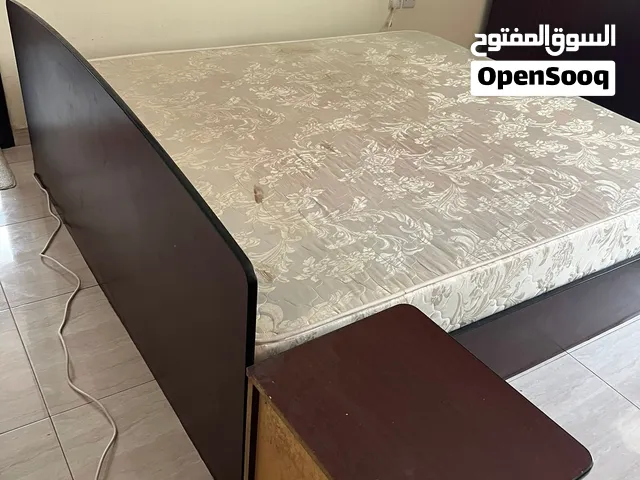 King size bed with mattress and side table
