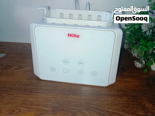 جهاز تسخين وتعقيم الحليب الاطفال ماركه Nuby