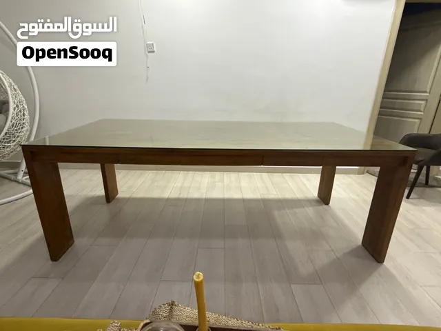 طاولة طعام (خشب طبيعي  ) من شركة مارينا  Natural Wood Dining Table with Glass Top – Marina Furniture