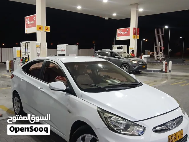 2014 Hyundai Accent Sedan for Sale - White Hybrid with Electric Mirrors and Bluetooth