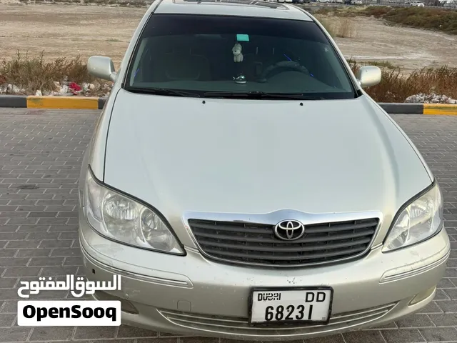 تويوتا كامري2004 الون فضي حالة ممتازة