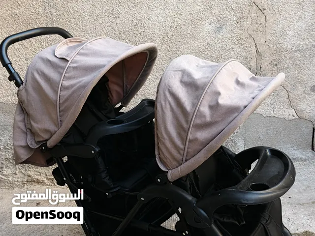 عربة اطفال توئم