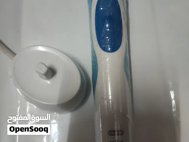 فرشاة أسنان قابلة للشحن جديد غير مستعلعبة الرماية.مع ساعه كوكو . أصلي +فرشاة أسنان قابلة للشحن جديد