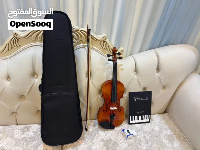 ألة كمان خشبيه