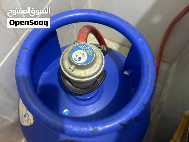 اسطوانة غاز مع منظم وخرطوم بحالة جيدة