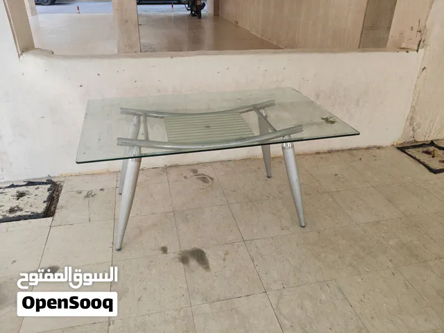 ترابيزة سفرة كبيرة بلوح زجاج سميك وقاعدة إستانليس