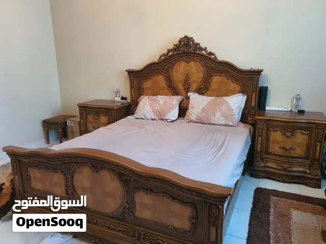 Classic Ornate Bedroom Set with, Nightstands, Mirror, and seats