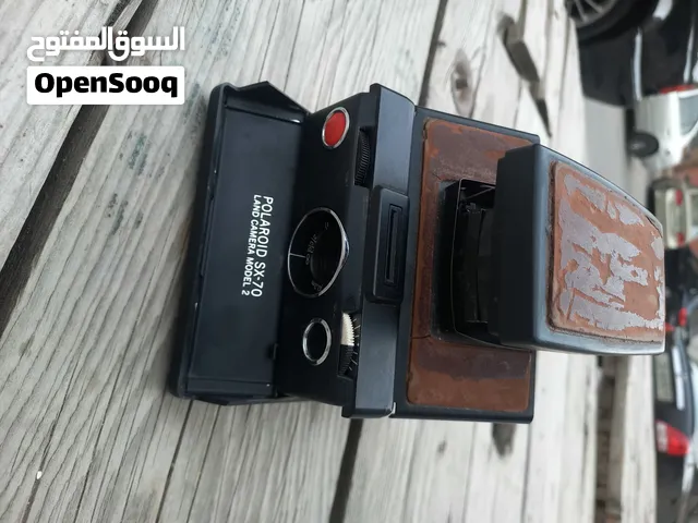 polarid sx70 & OLYMPUS & KODAK DISC