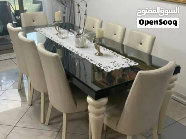 طاولة طعام جلد 8 اشخاص