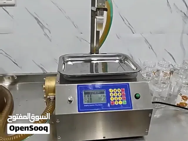 جهاز تعبئة السوائل الخفيفة واللزجة الأوتوماتيكي صيني المنشأ ماطور نحاس