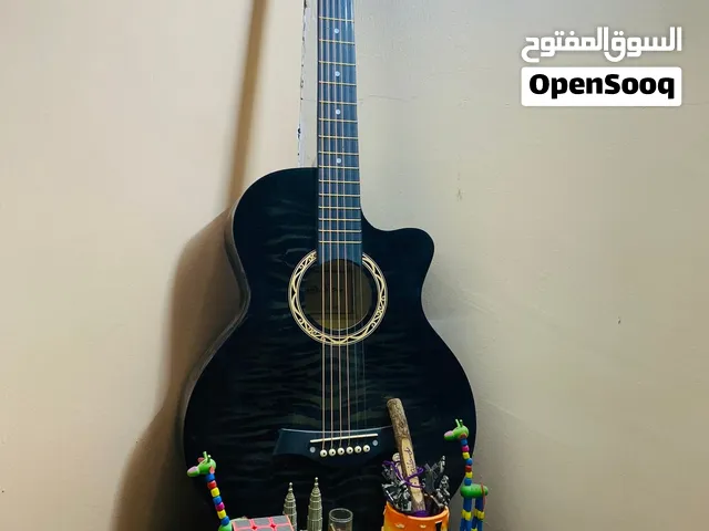 جيتار خشب كامل مع وتر احتياطي وريشة اوتار نحاس
