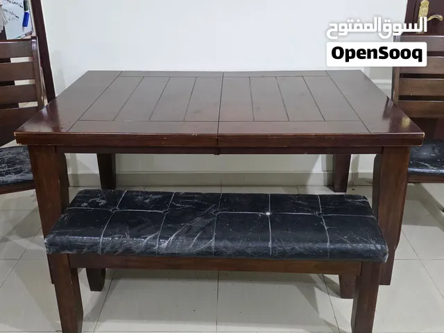 dining table and chairs and one long table