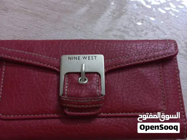 محفظة ناين وست الاصلية