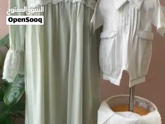 طقم استقبال مولود مع الام من المصممه عزيزه الحارثي