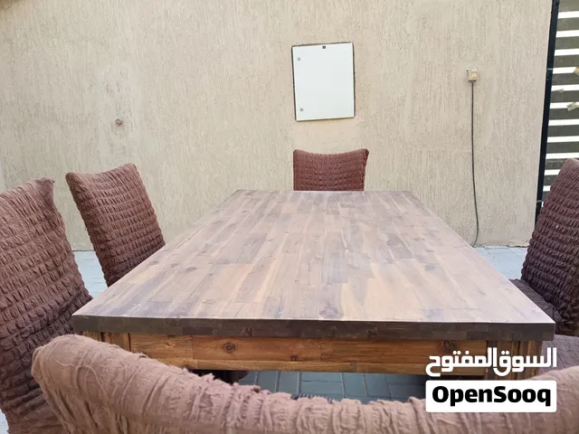 Solid wood table with 6 brown covered chairs