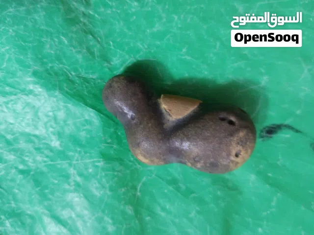 حجر سلطاني علي شكل كاءن فضاءي