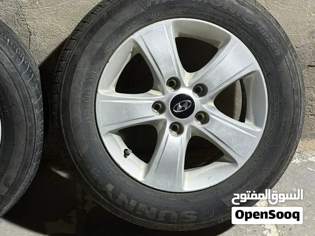 تخم ويل كب مع اطارات صيني مستعمل نص عمر قياس 15 خمسة ستد يرهم على جميع السيارات الكوري 5 ستد