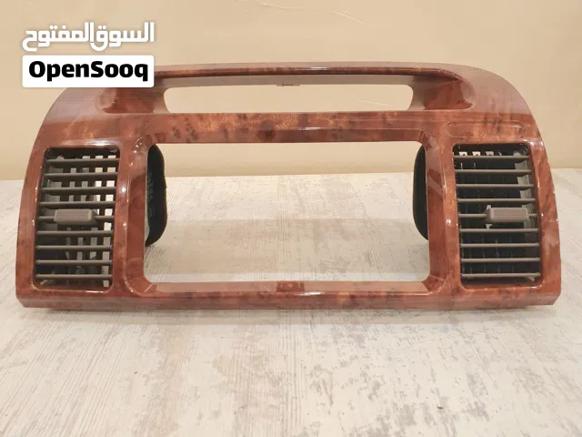 للبيع ديكور تكيف خشبي جهة الوسط كامري2003-2006جديد بالكرتون