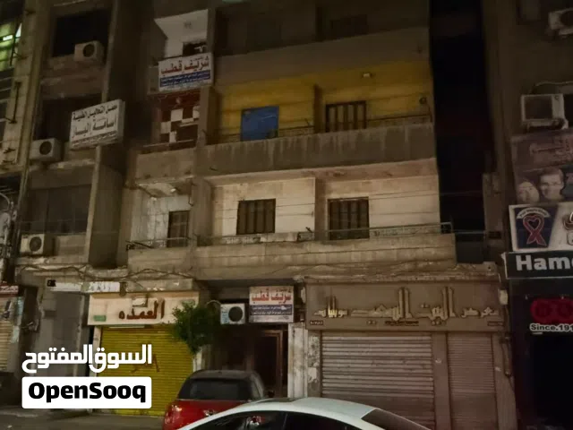 عقار فارغ للبيع اربع ادوار وعدد 2محل