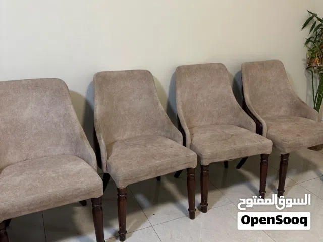 Set of Three-seater furniture set with a coffee table, dining table, and 6 chairs