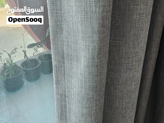 Light grey curtain + sheer curtains + rods