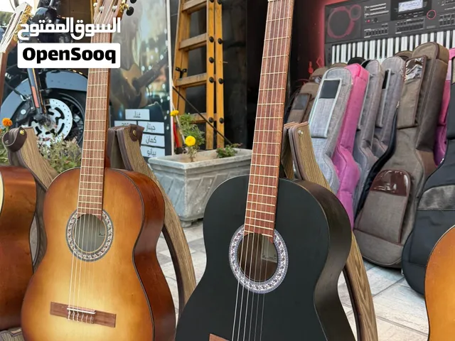 جيتار قاروط  m10 كلاسيك اللصلي صناعة يدوية  بسعر 75  دينار  شامل  حقيبة وريشة
