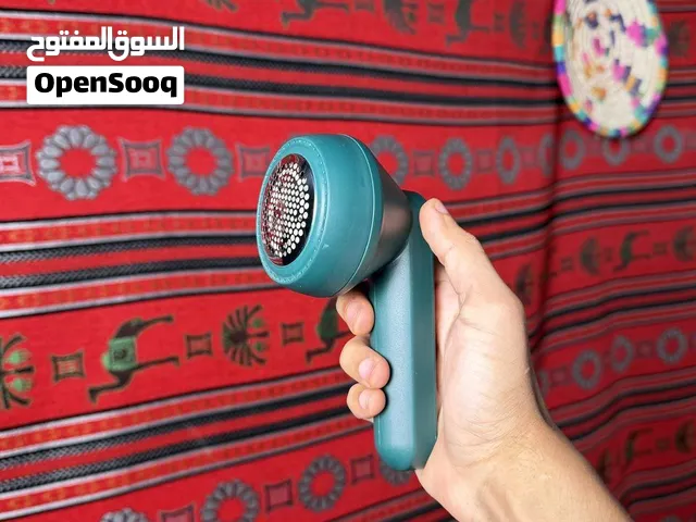 ماكينة إزالة وبر الملابس المحمولة