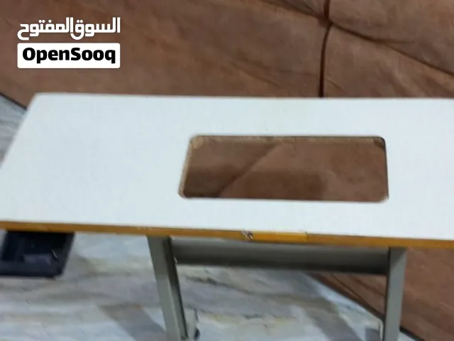 طاولة مكينة خياطه