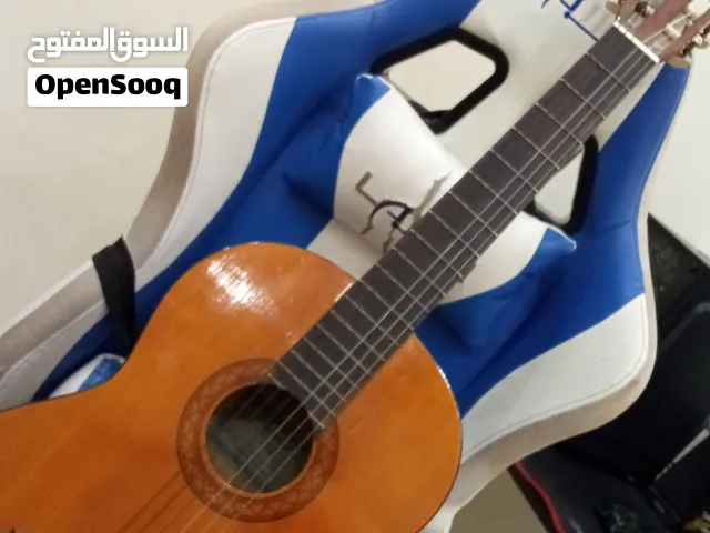 گيتار خشب جديد تجي تفحصه وتشوفه عجبك اخذه ما عجبك ع راحتك بس انه ما مستخدمه مخلي ع ميز فيكه