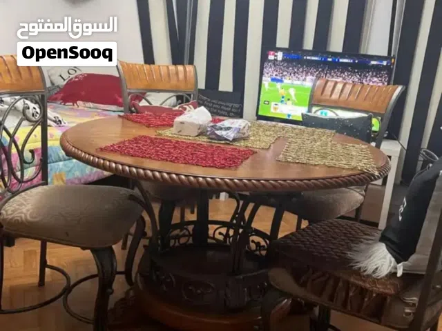 طاولة سفرة مع اربع كراسي وبوفيه خشب سويدي